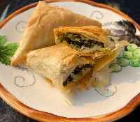Spanakopita, spinach-filled phyllo triangles